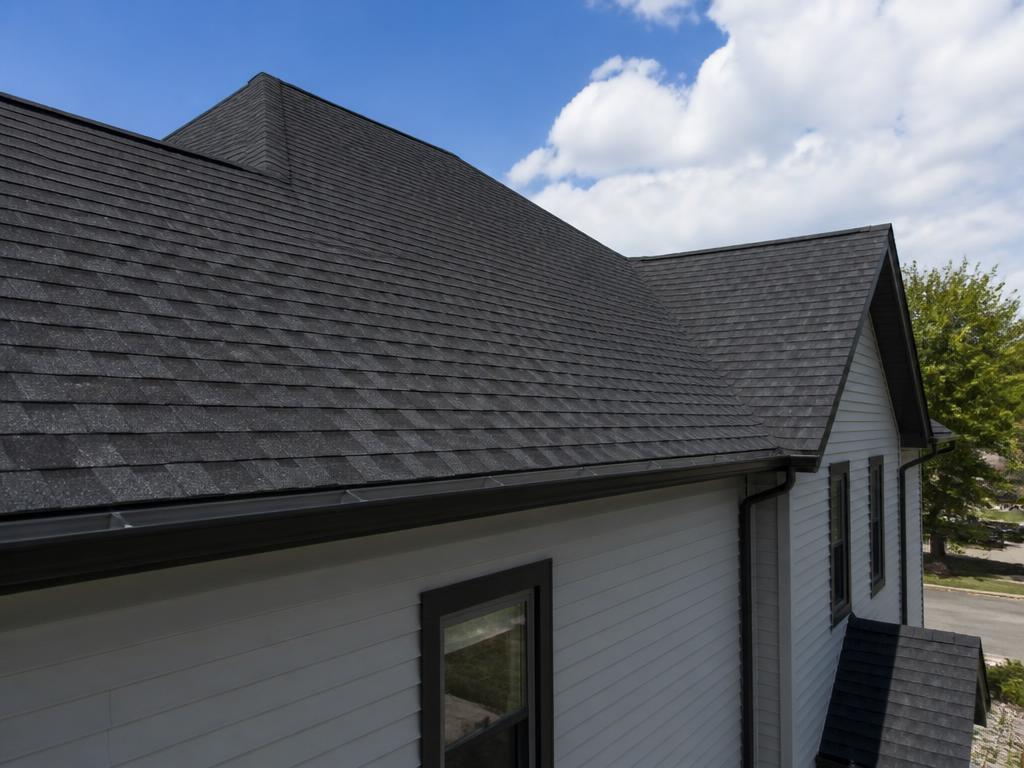 New dark asphalt shingle roof on a residential home